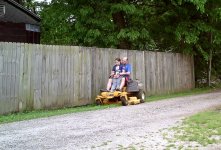Robb and the kid mowing.jpg