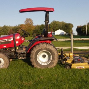 My tractor  before the FEL was purchased. We mow with a 72"KK RD mower. As of 2010 the KK has mowed about 4500 acres with NO maitaince issues. Lots of