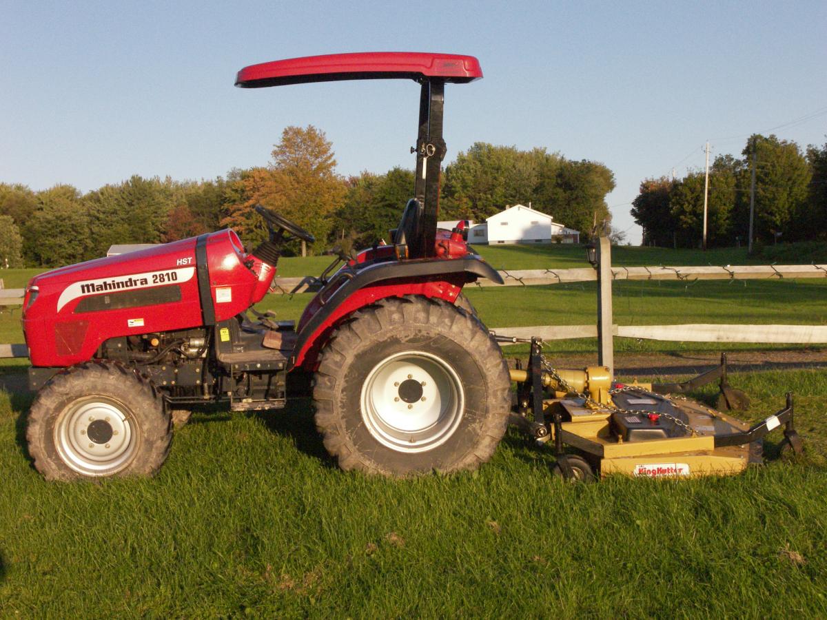 My tractor  before the FEL was purchased. We mow with a 72"KK RD mower. As of 2010 the KK has mowed about 4500 acres with NO maitaince issues. Lots of