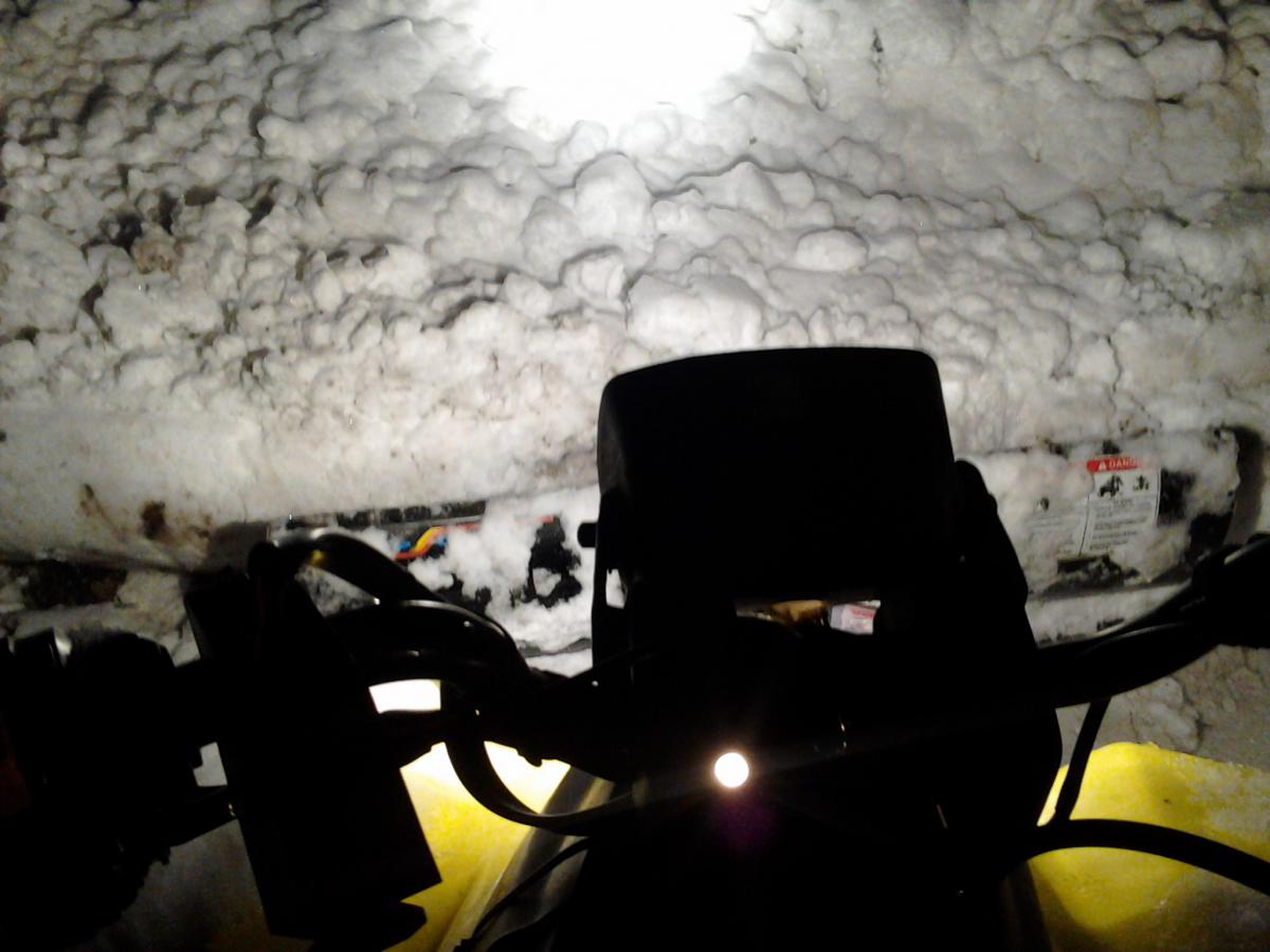 Sitting on the quad looking at handlebars/back of plow.